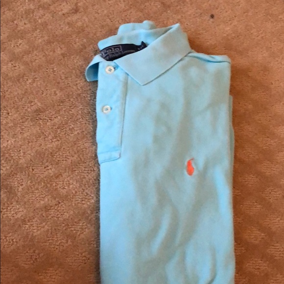 blue polo shirt with orange horse